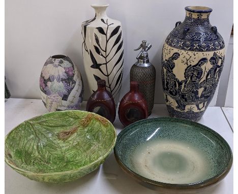 A Royal Doulton 'Titanium' bowl of shallow circular form and having a mottled glaze, 37.5cm w, leather stitched bound decante
