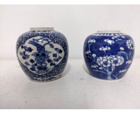 Two late 19th /early 20th century Chinese porcelain ovoid jars, one decorated with qutrolobed panel of a bird perched amongst