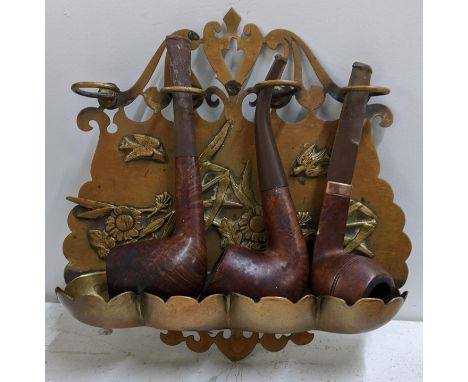 A brass hanging pipe rack containing three pipes, one with a 9ct gold bandLocation:If there is no condition report shown, ple