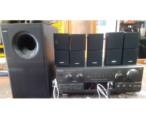 A Bose and Technics surround sound comprising a Bose Acoustimass 15 sub woofer home theatre speaker system, a Technics AV Con