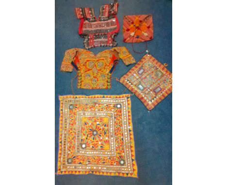 A group of traditional hand embroidered Indian decorative items to include a Dandiya dance blouse, a Banjara textile panel wi