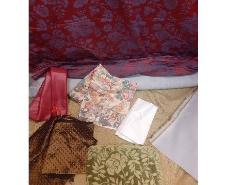 Mixed fabrics to include a bolt of green furnishing fabric having a swirl design and backed in a lightweight grey canvas 140c