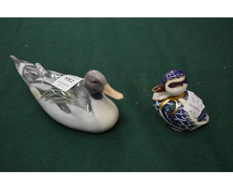 Royal Crown Derby duckling and a Royal Copenhagen duck.