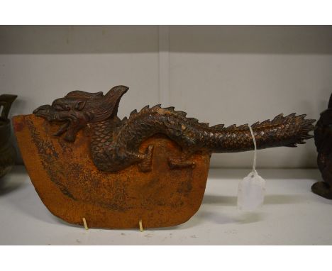 A Chinese bronze and steel axe modelled as a dragon.
