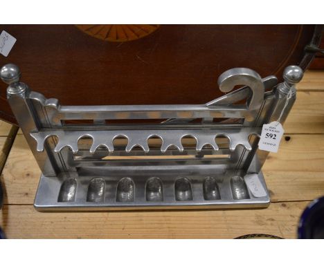An aluminium pipe rack modelled as a five bar gate.