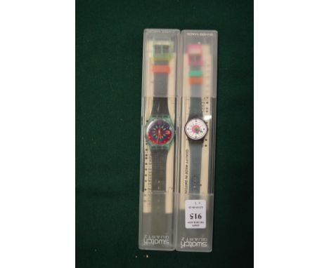 Two Swatch watches.