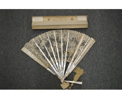 A Brussels lace fan with original box.