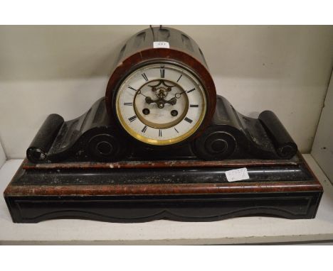 A large Victorian slate mantel clock with breguet visible escapement, the dial signed Henry Marc, Paris.