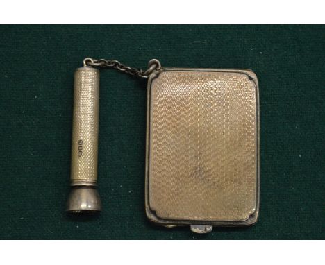 A silver match case and cigar pricker.