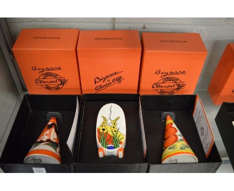 Two Wedgewood Clarice Cliff collection Bizarre conical shaped sugar shakers, boxed and another sugar shaker, boxed.