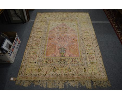 A part silk Persian prayer rug, pink ground with floral decoration, 188cm x 139cm.