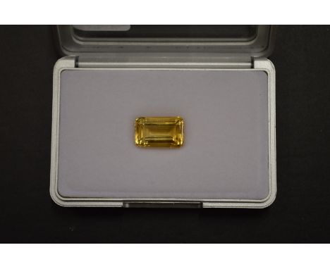 An emerald cut citrine, boxed with certificate.