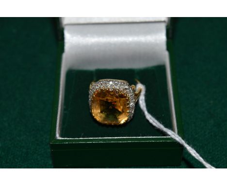 A good citrine and diamond ring stamped 18ct and platinum.