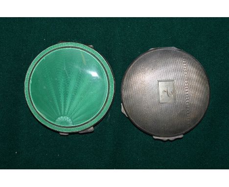 Silver and enamel compact and another silver compact.