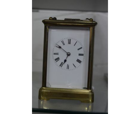 A brass carriage clock.