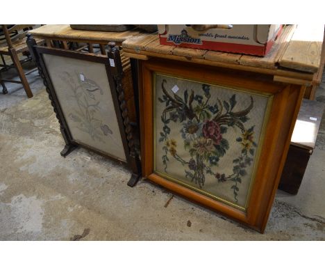 An oak fire screen with needlework panel together with a wool work picture, framed and glazed.