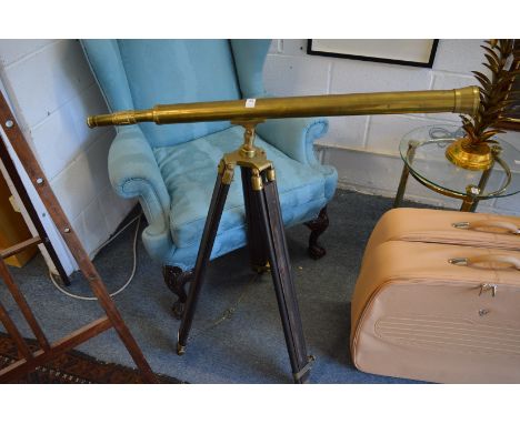 Brass telescope on stand.