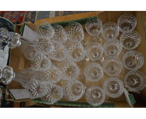 A suite of Tudor glassware comprising twelve red wine, twelve white wine and pair of decanters.