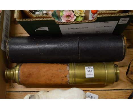 A brass and leather telescope with leather storage case.