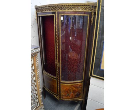 A French ormolu and mahogany bow fronted two door vitrine (one door unglazed).
