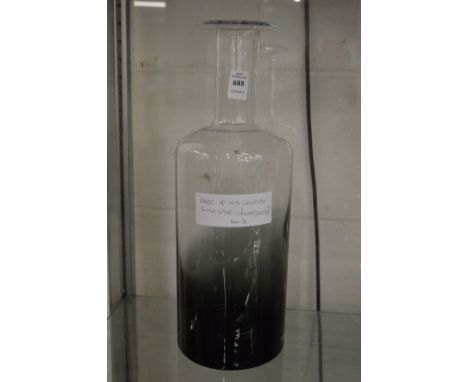 A large glass bottle vase, possibly by Holmegaard.