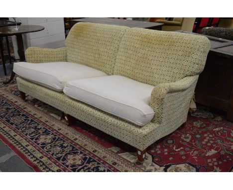 Howard &amp; Sons, a large two seater settee, 20th century.