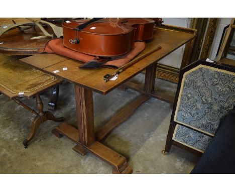 An oak plank top refectory style dining table.
