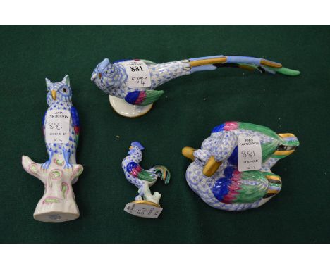 A group of Herend porcelain birds.