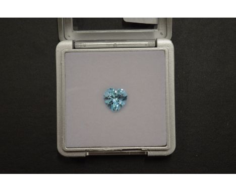 A heart shaped blue topaz, boxed with certificate.