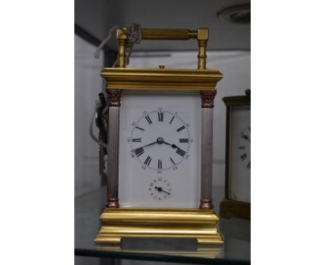 A brass carriage clock.