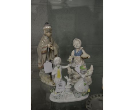 A Rosenthal figure and two other Continental figures.