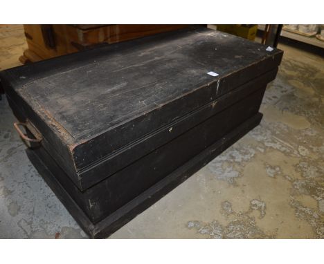 An old pine trunk containing tools.