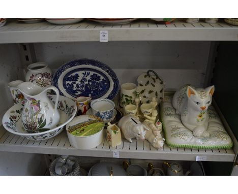 A quantity of decorative china to include a large pottery model of a cat on a cushion.
