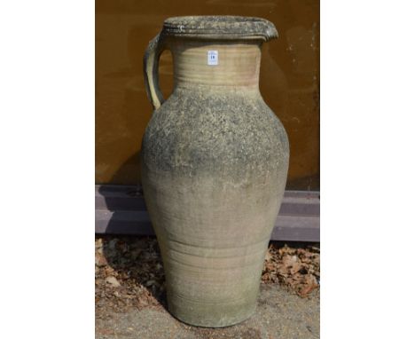 A large earthenware jug style planter or vase.