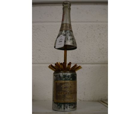 A stylish cigarette dispenser modelled as a White Star Moet and Chandon champagne bottle, the rising upper section opening to