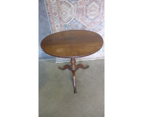 A Georgian oak tilt top side table on a tripod base. 68cm tall x 75cm diameter. 