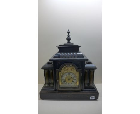 A wooden ebonised German 14 day striking mantle clock, running, no key, 52cm tall, 43cm wide 