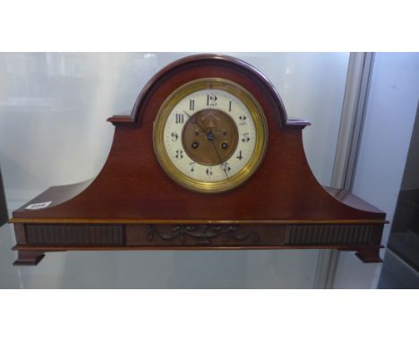 An Edwardian mahogany mantle clock with exposed escapement, 29cm tall, 54cm wide, running but stops, no key, case in good con