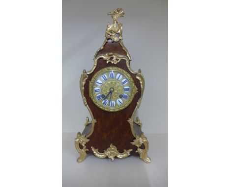 A walnut and ormolu french baroque style mantle clock striking on a bell, running, generally good condition, no key, 35cm tal