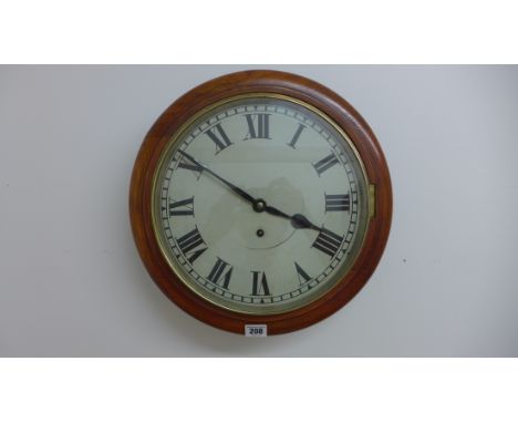A 12 inch dial spring drive wallclock, brass bezel ,oak surround - running 