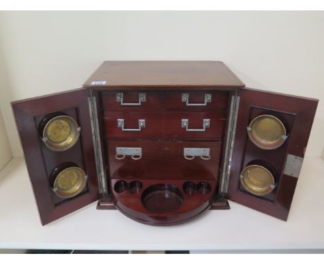 An Edwardian inlaid mahogany cabinet with 3 drawers and a revolving pipe rest, 36cm tall, 36 x 27, in good condition 