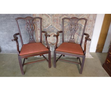 A pair of mahogany Chippendale style open armchairs with vase shaped splats on square moulded legs 