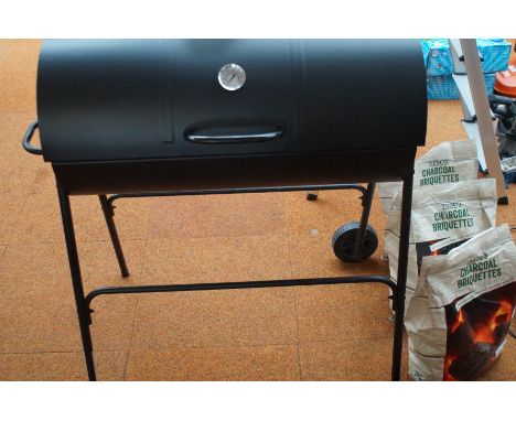 Double barbecue with thermometer used with 2 1/2 bags of coal 