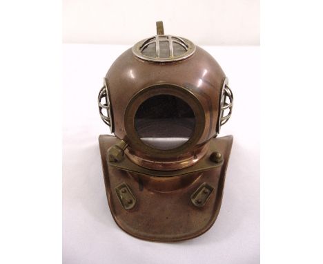 A miniature brass and bronze early divers helmet