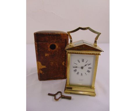 R.L. Christie of Edinburgh carriage clock of architectural form with Roman numerals, white enamel dial, to include key and le