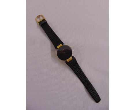 Christian Dior gold plated gentlemans dress watch with black dial on leather strap