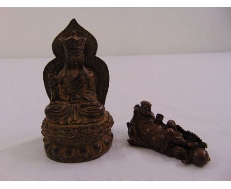 Two Chinese cast bronze figurines of Lohan and Guanyin