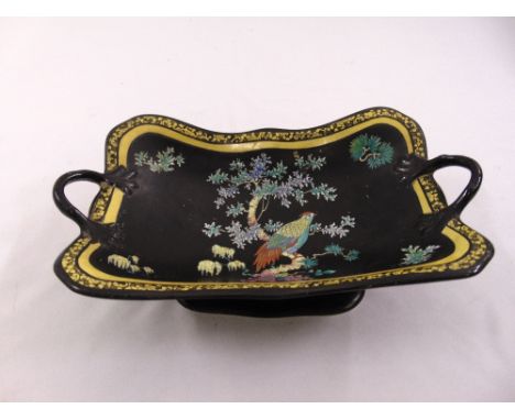 A Carltonware black glazed Chinese style fruit bowl of shaped rectangular form with two side handles on raised rectangular ba