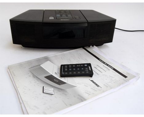 A Bose Wave radio/CD model AWC3G in black, with remote and instructions