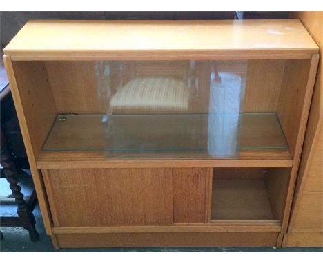 A G-Plan glazed cabinet with glass shelf over sliding cupboard doors, 85cmH